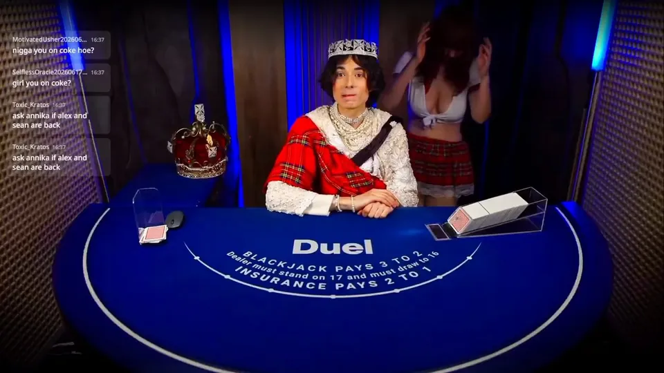 Annika standing to the right of a crowned Duel blackjack dealer