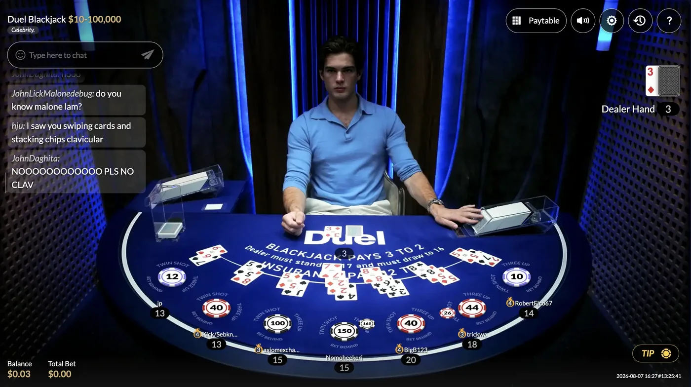 The Duel Blackjack live table on 7 August 2026: a dealer in a blue polo behind the shoe, seven boxes dealt across the blue felt, the header reading Duel Blackjack $10-100,000 with a Celebrity badge, and chat messages addressing the dealer as clavicular