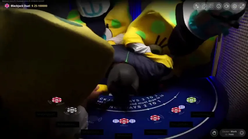 A yellow spotted costume sprawled across the dealer's side of the Duel Blackjack layout with seven bet spots live