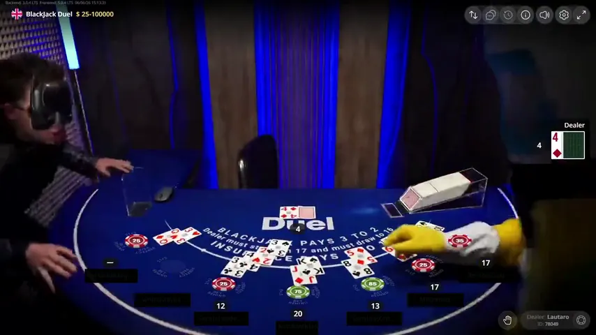 The yellow costume reaching across the Duel Blackjack layout toward the card shoe