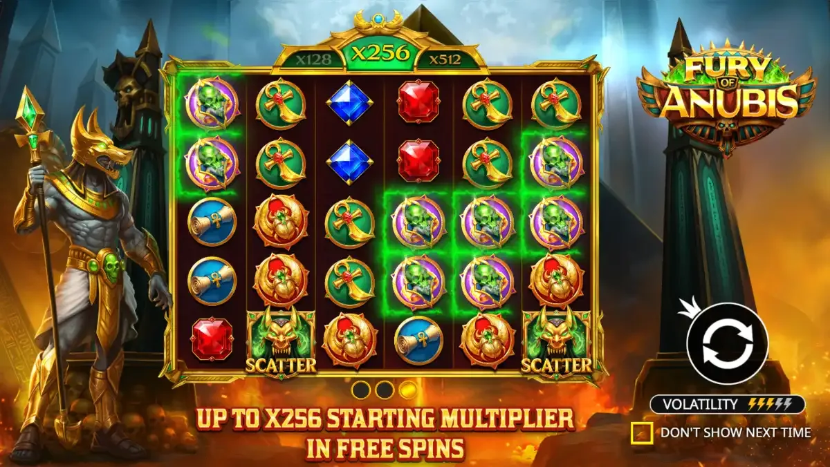 Fury of Anubis intro screen: Anubis stands left of a 6x5 grid, the meter above the reels highlights x256, the banner reads Up to x256 starting multiplier in free spins, and the volatility bar shows five lightning bolts